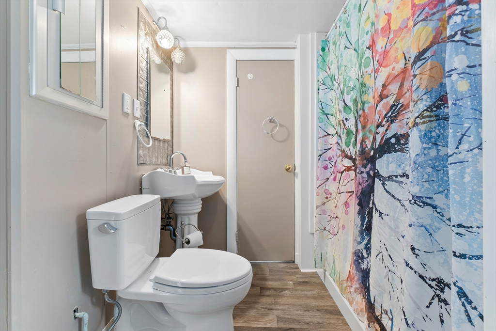 159 Jenness Street Lynn, MA 01904 - Photo 11 of 36 a bathroom with a sink and mirror with toilet