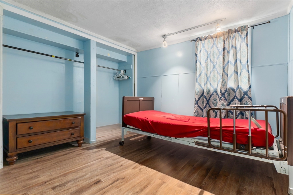 159 Jenness Street Lynn, MA 01904 - Photo 20 of 36 a bedroom with double bunk beds and a window