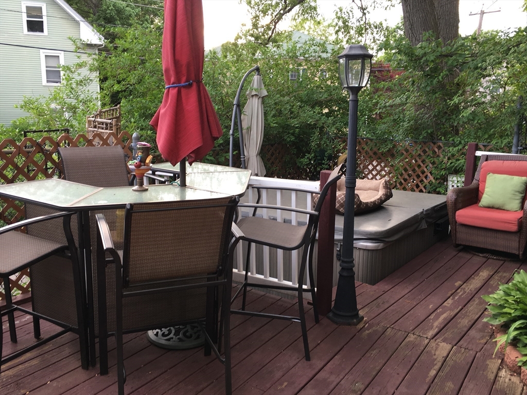 159 Jenness Street Lynn, MA 01904 - Photo 28 of 36 a view of a chairs and table on the deck