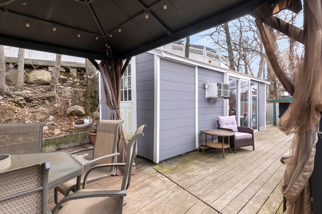 159 Jenness Street Lynn, MA 01904 - Photo 33 of 36 a view of a porch with furniture and a yard