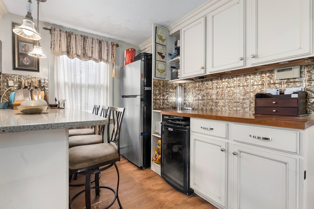159 Jenness Street Lynn, MA 01904 - Photo 4 of 36 a kitchen with stainless steel appliances granite countertop a refrigerator and a stove top oven