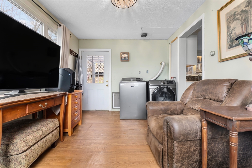 159 Jenness Street Lynn, MA 01904 - Photo 6 of 36 a living room with furniture and a flat screen tv