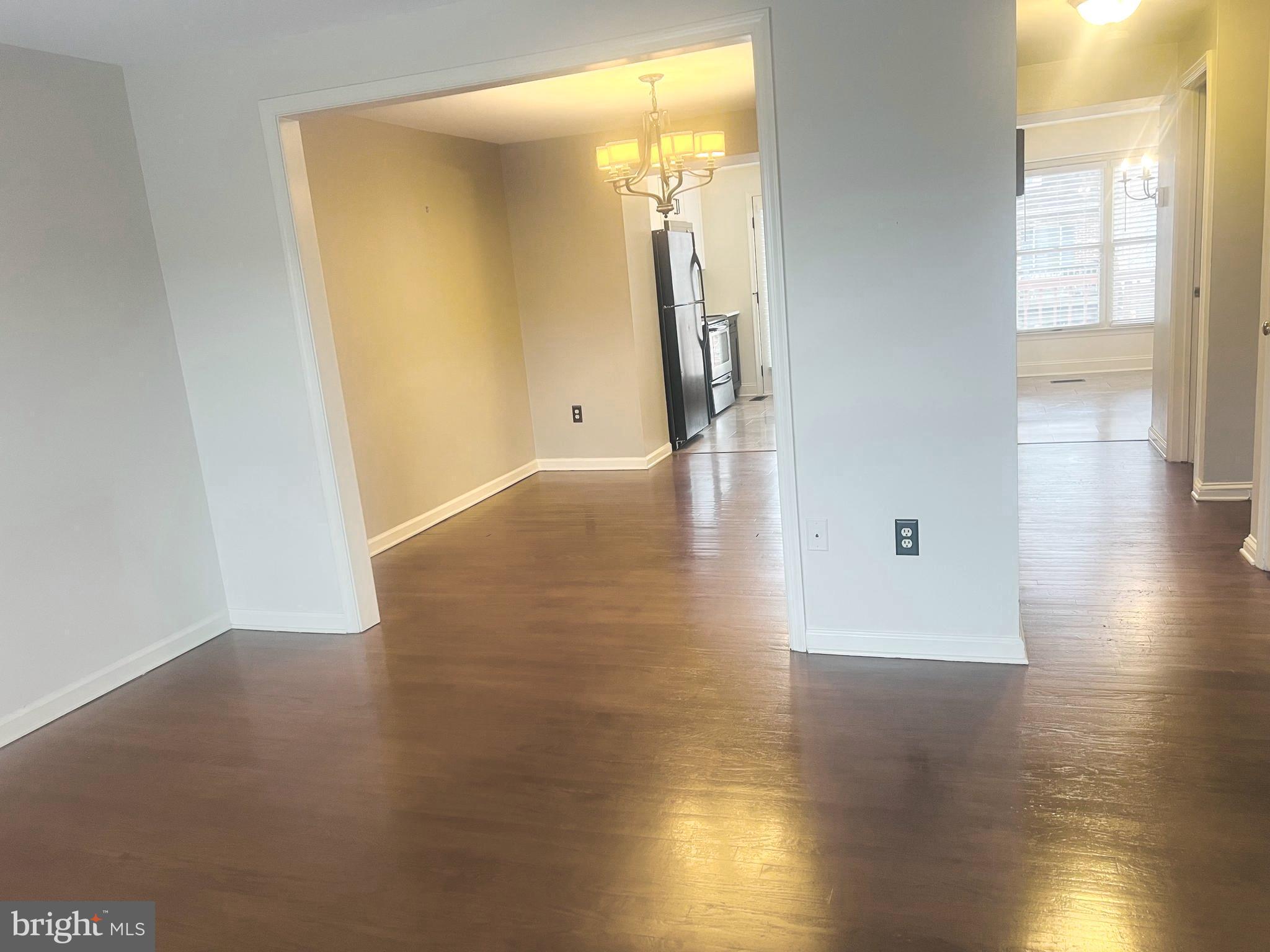 8024 Hollow Reed Court Frederick, MD 21701 - Photo 11 of 31 a view of a hallway with wooden floor