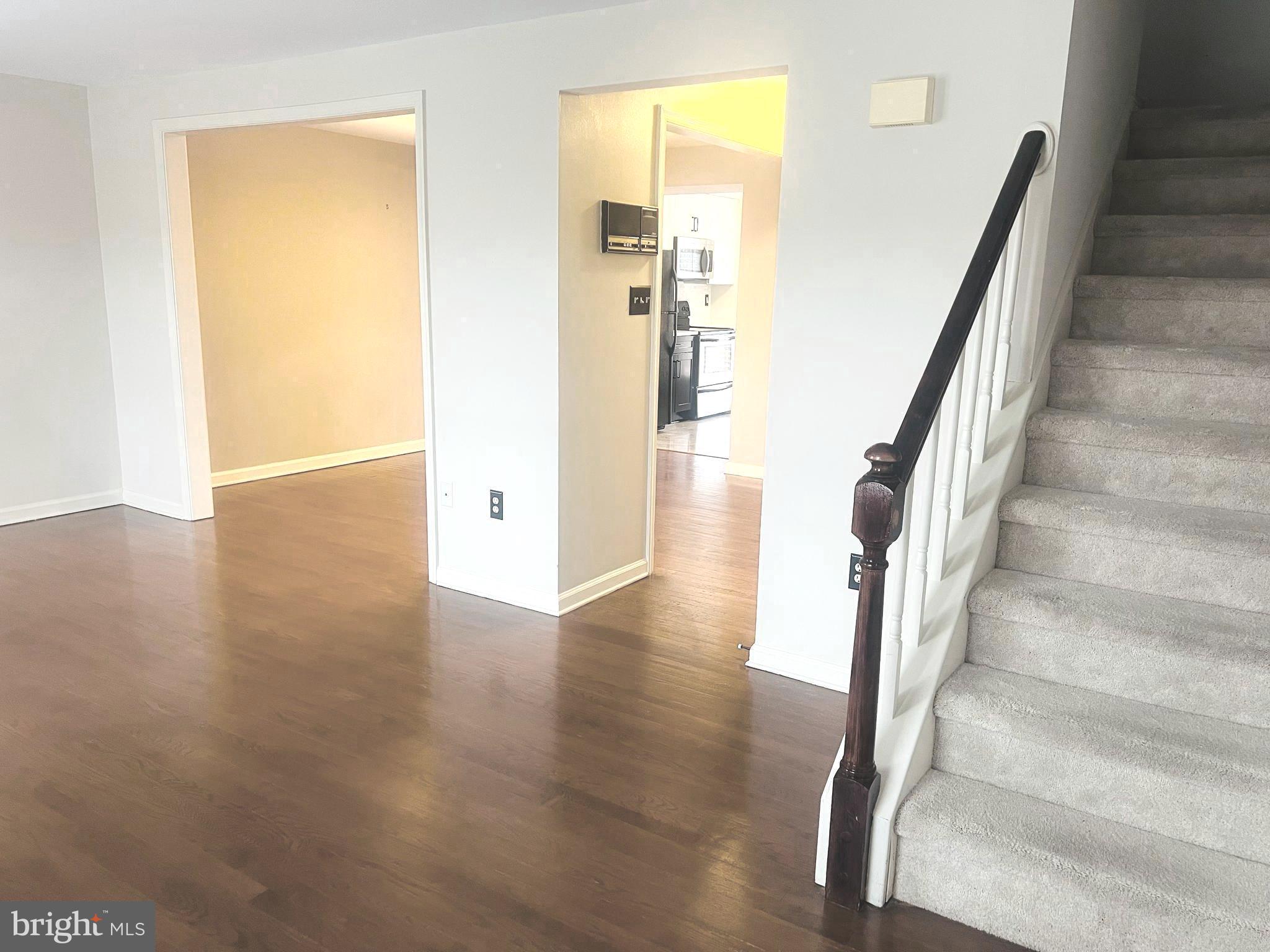 8024 Hollow Reed Court Frederick, MD 21701 - Photo 14 of 31 a view of entryway and hall with wooden floor