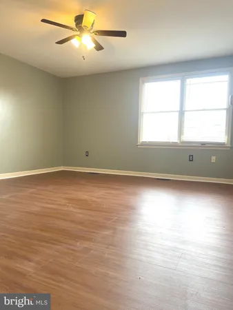 a bathroom with a sink mirror and toilet