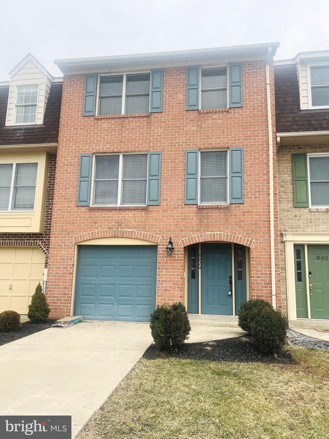 8024 Hollow Reed Court Frederick, MD 21701 - Photo 2 of 31 a front view of a house with a yard and garage