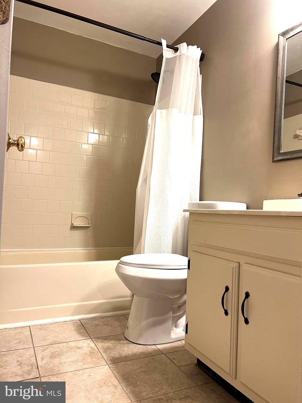8024 Hollow Reed Court Frederick, MD 21701 - Photo 21 of 31 a white toilet sitting next to a bath tub and shower