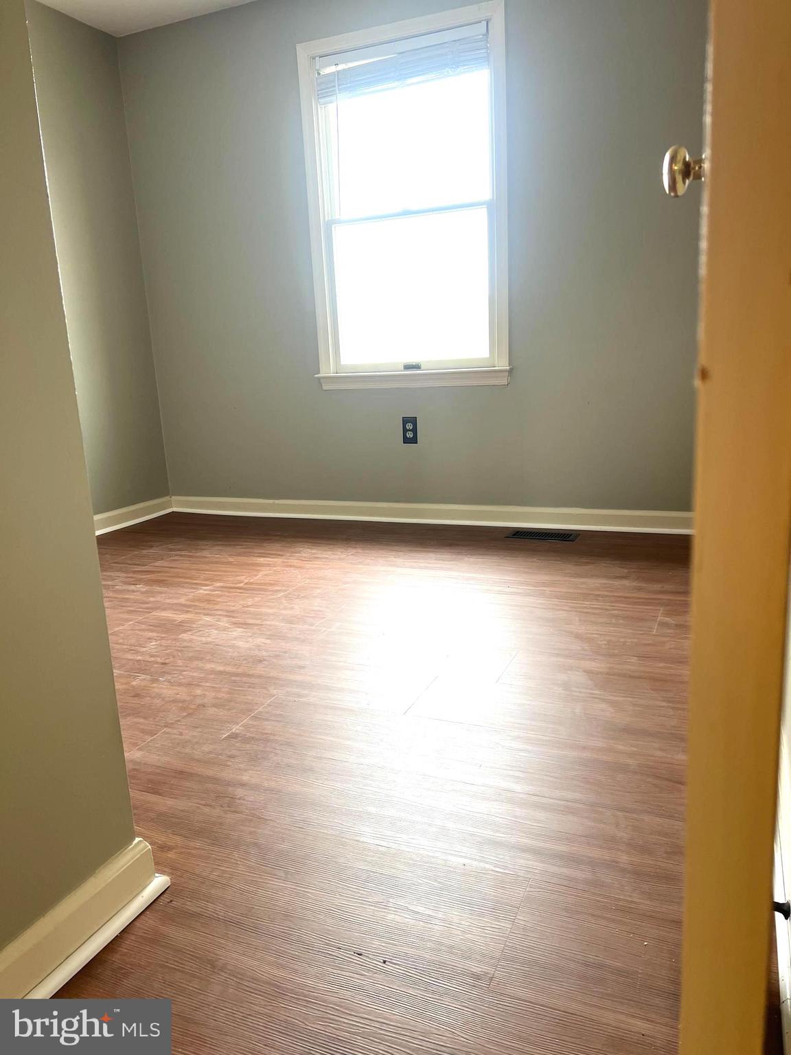 8024 Hollow Reed Court Frederick, MD 21701 - Photo 22 of 31 a view of a room with wooden floor and windows