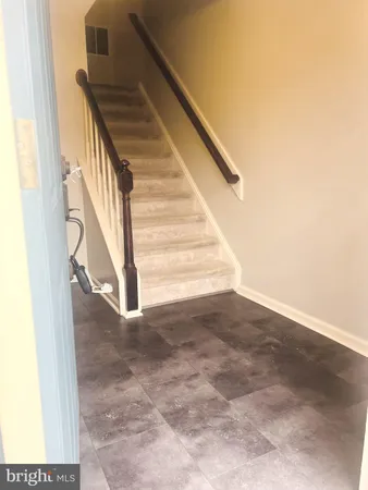 a kitchen with a refrigerator and a sink