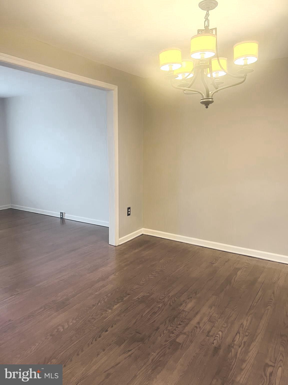 8024 Hollow Reed Court Frederick, MD 21701 - Photo 9 of 31 en empty room with wooden floor and windows