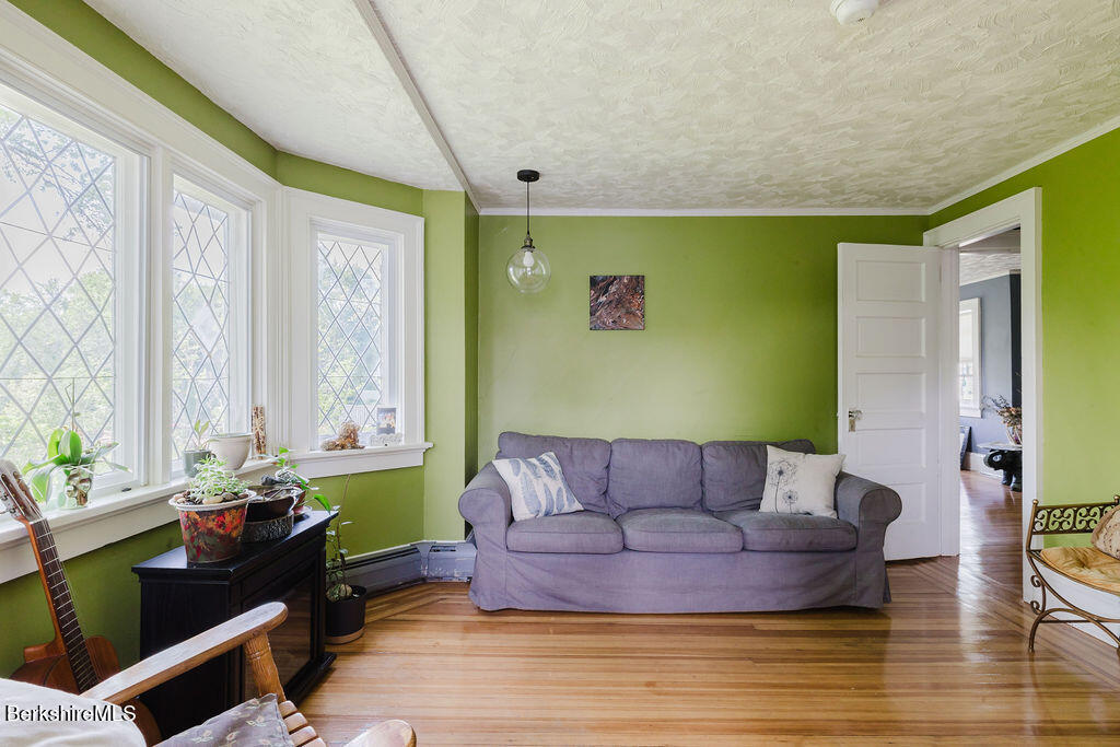 168 Main Street Sheffield, MA 01257 - Photo 32 of 55 a living room with furniture and a large window