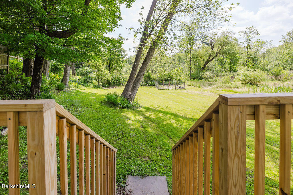 168 Main Street Sheffield, MA 01257 - Photo 41 of 55 a view of a wooden deck and floor with trees