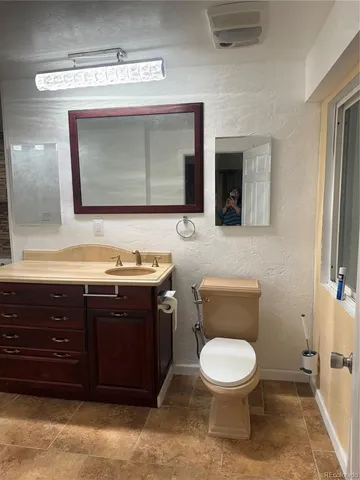 a spacious bathroom with a double vanity sink a mirror and bathtub