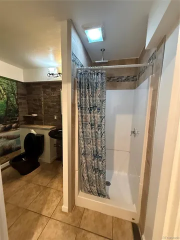 a kitchen with a sink and large window