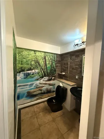 a view of a livingroom with furniture and a flat screen tv