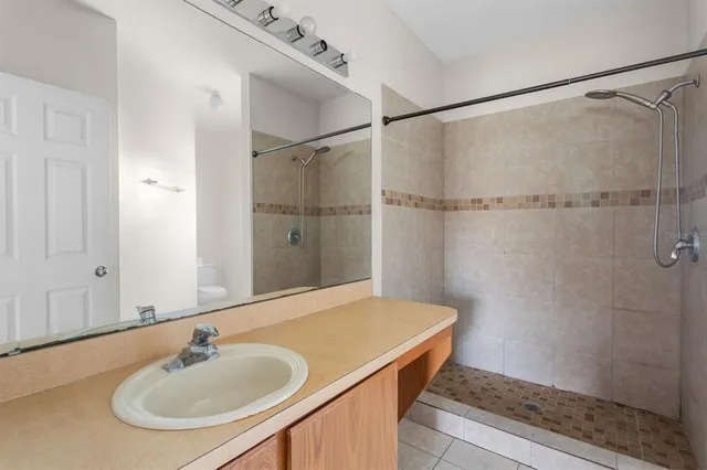 a bathroom with a sink and shower