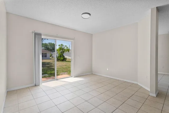 a view of an empty room and window