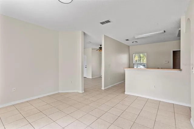 a view of a kitchen with wooden floor and a sink