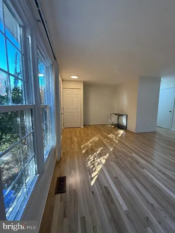 an empty room with wooden floor