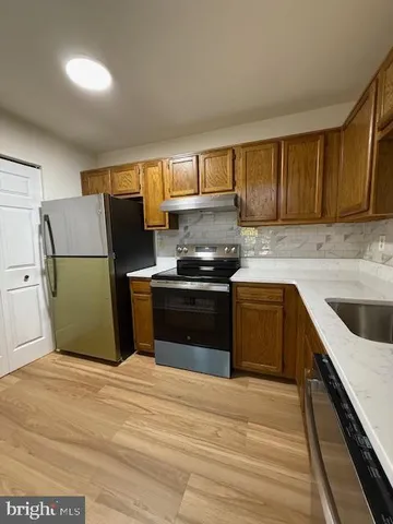 an entryway door with a hallway in the house