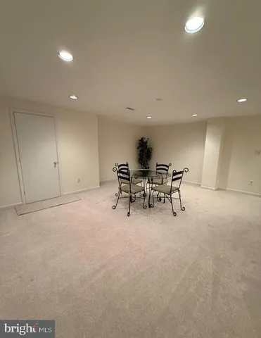 a view of a big yard with large trees