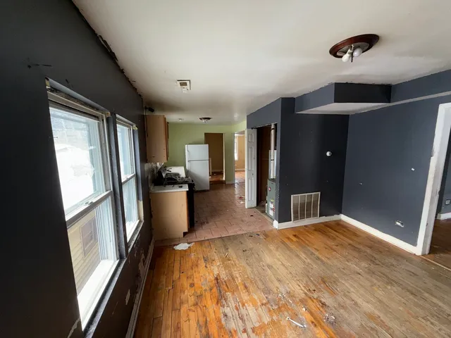 a view of a kitchen with a sink and a large window