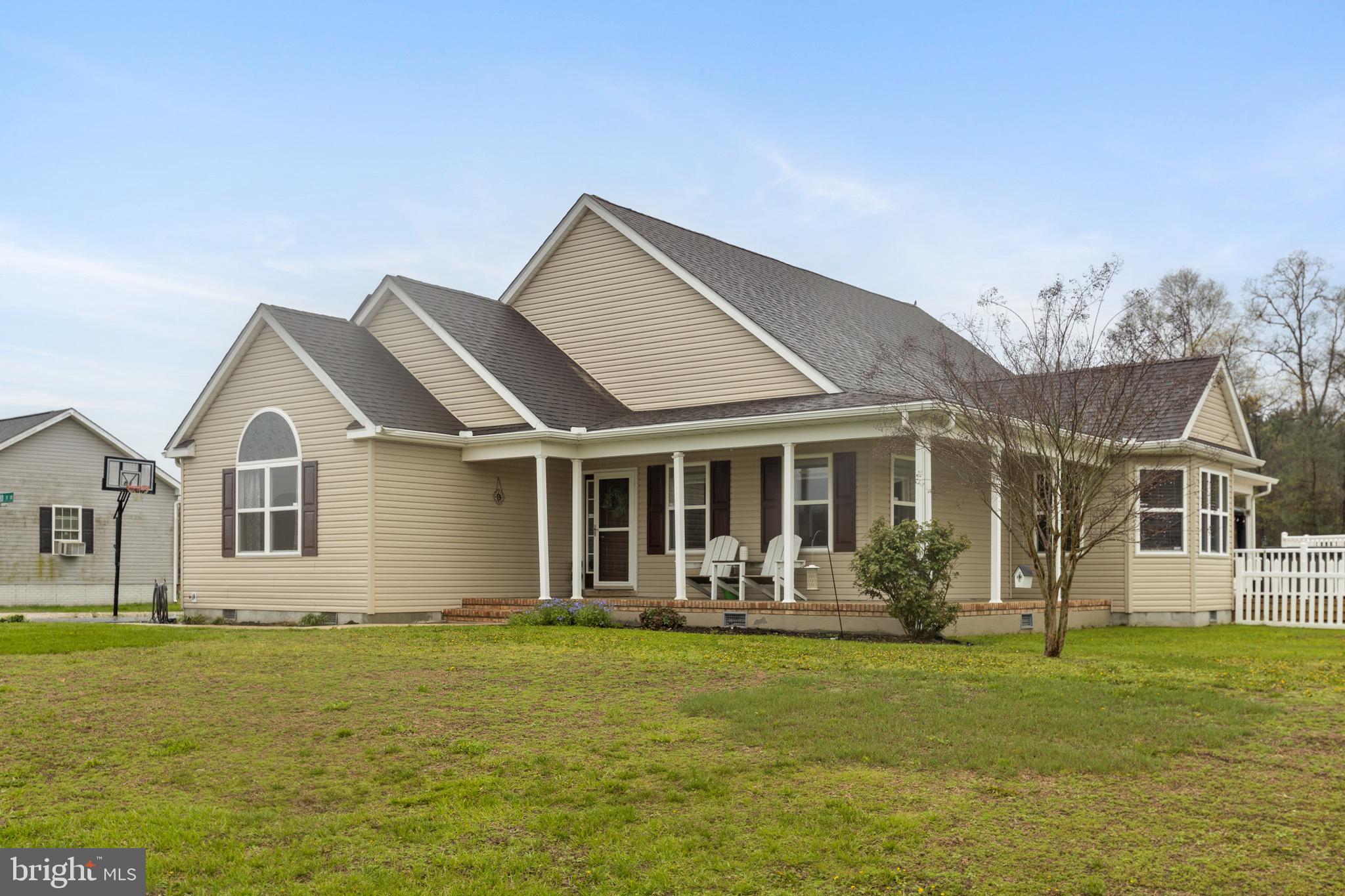 26179 Manor Way Georgetown, DE 19947 - Photo 1 of 87 a front view of house with yard and green space