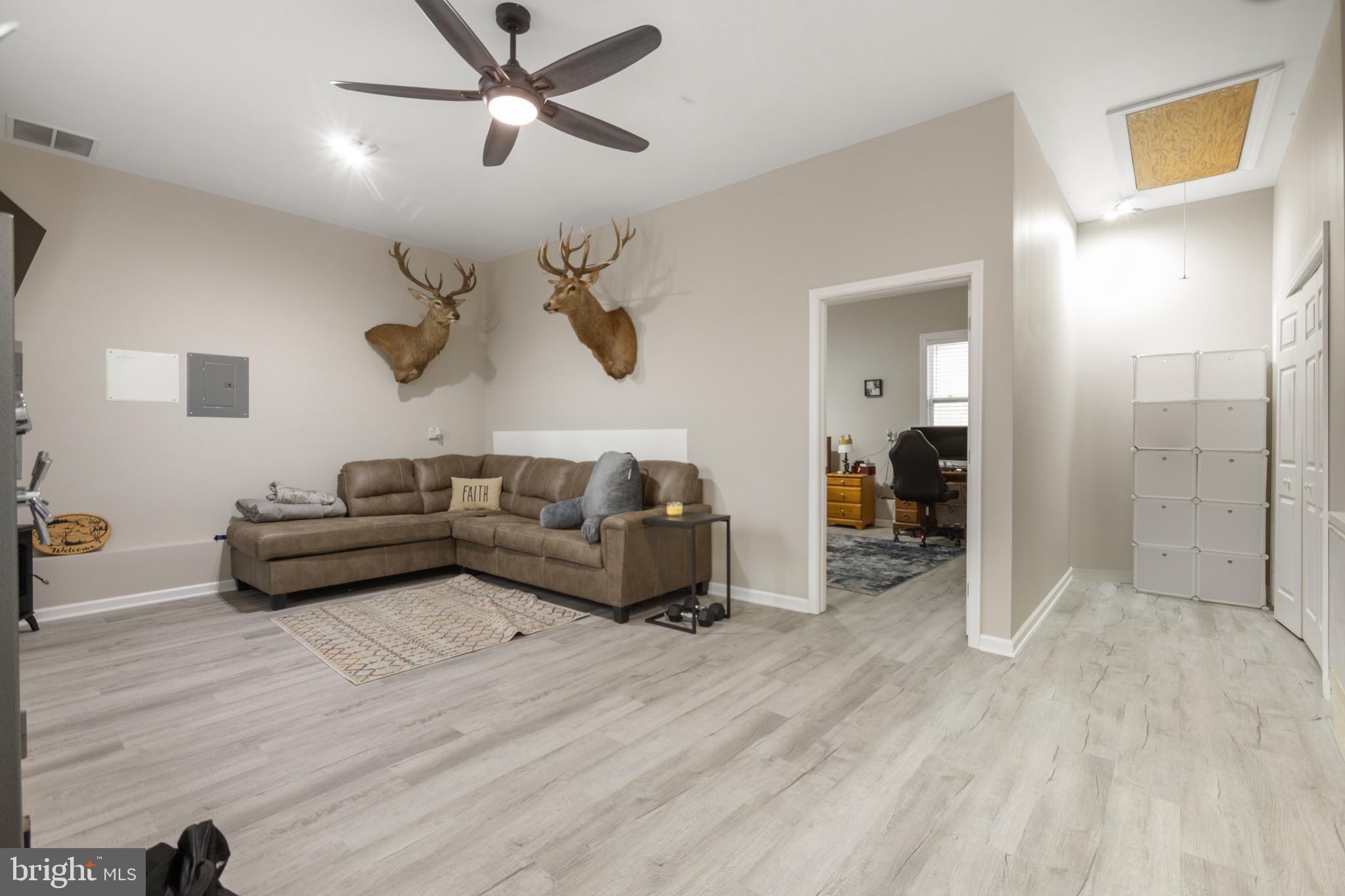 26179 Manor Way Georgetown, DE 19947 - Photo 19 of 87 a living room with furniture and a wooden floor