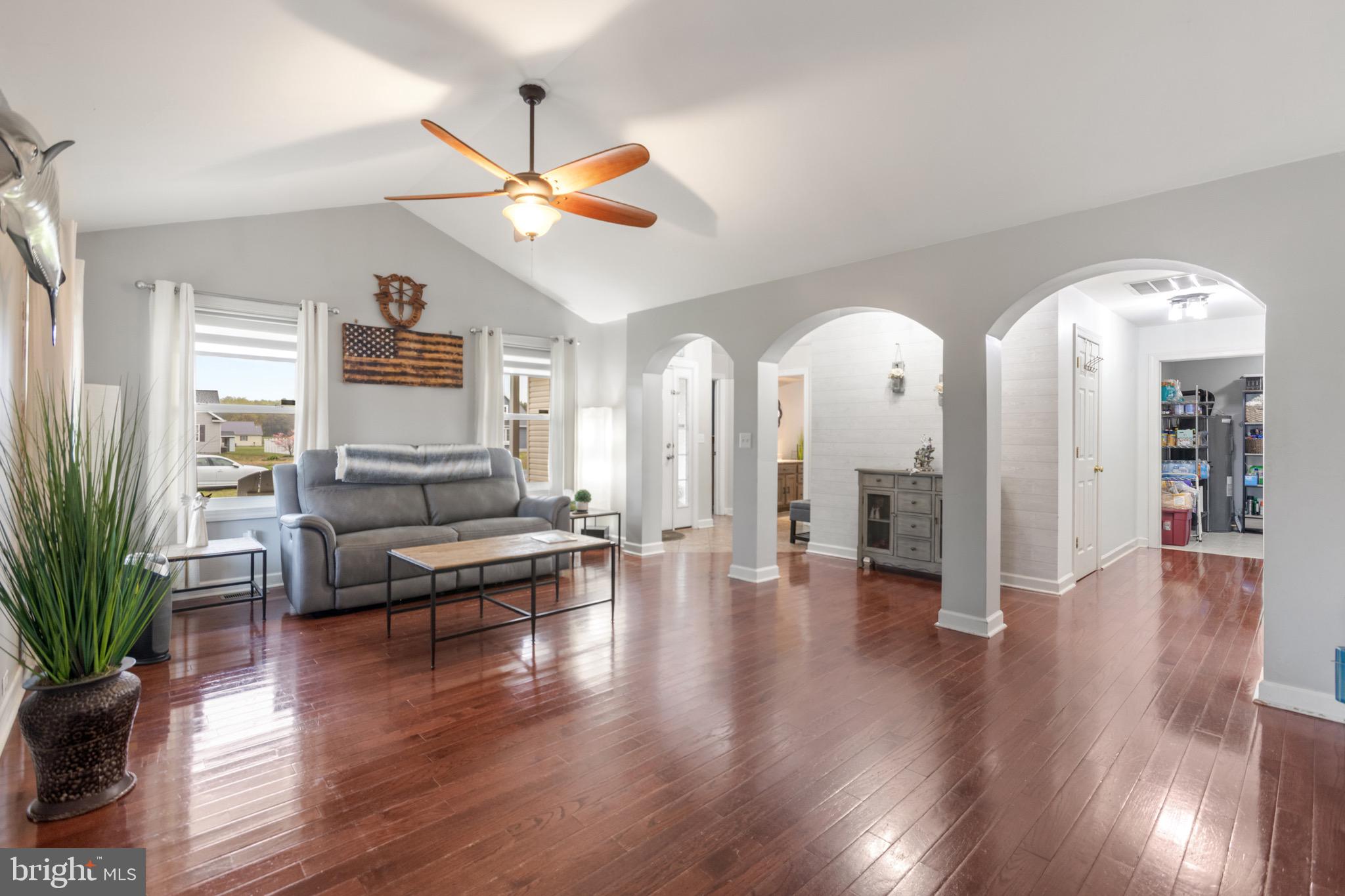 26179 Manor Way Georgetown, DE 19947 - Photo 2 of 87 a living room with furniture and wooden floor