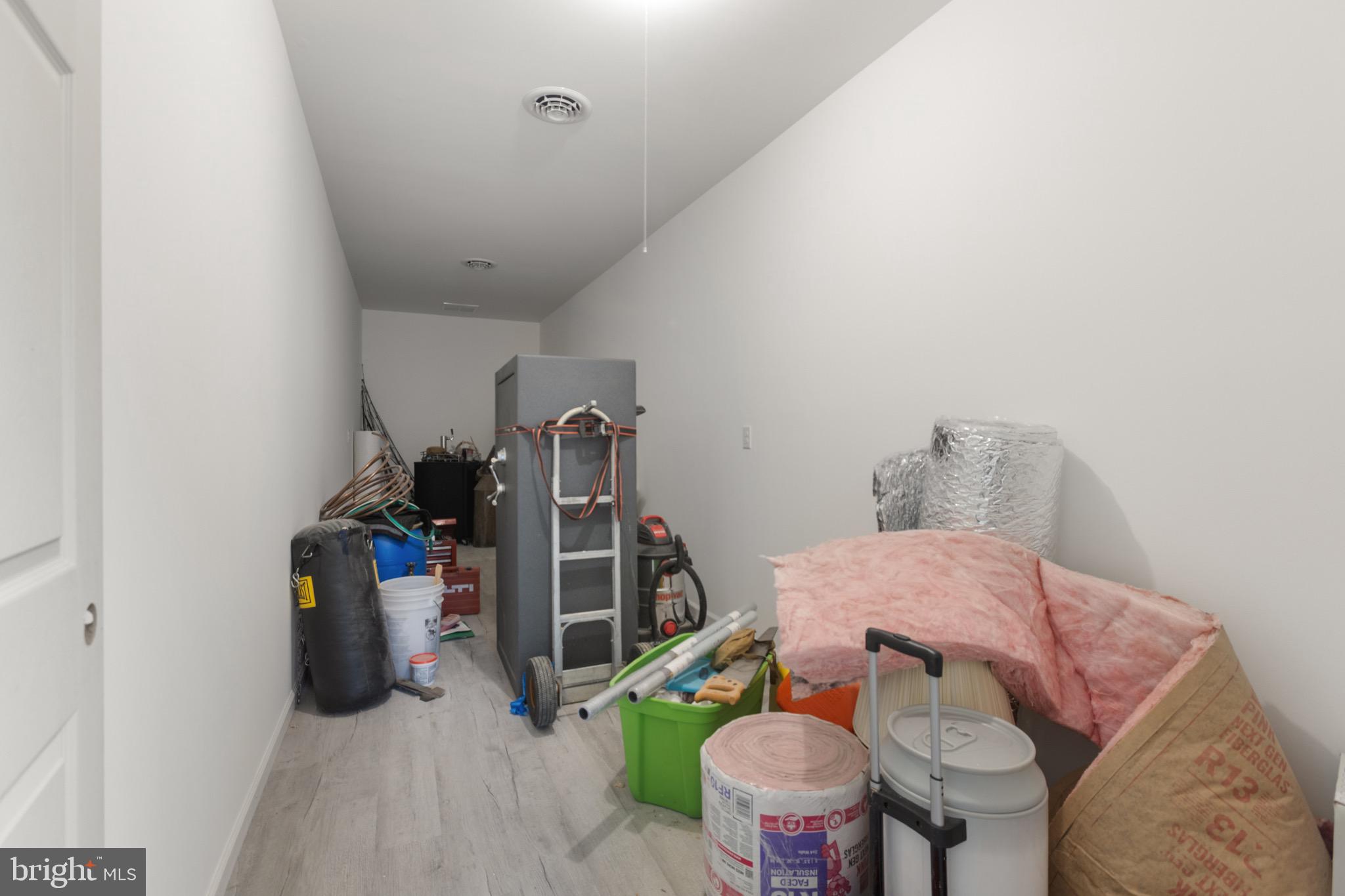 26179 Manor Way Georgetown, DE 19947 - Photo 42 of 87 a bedroom with furniture and a wooden floor