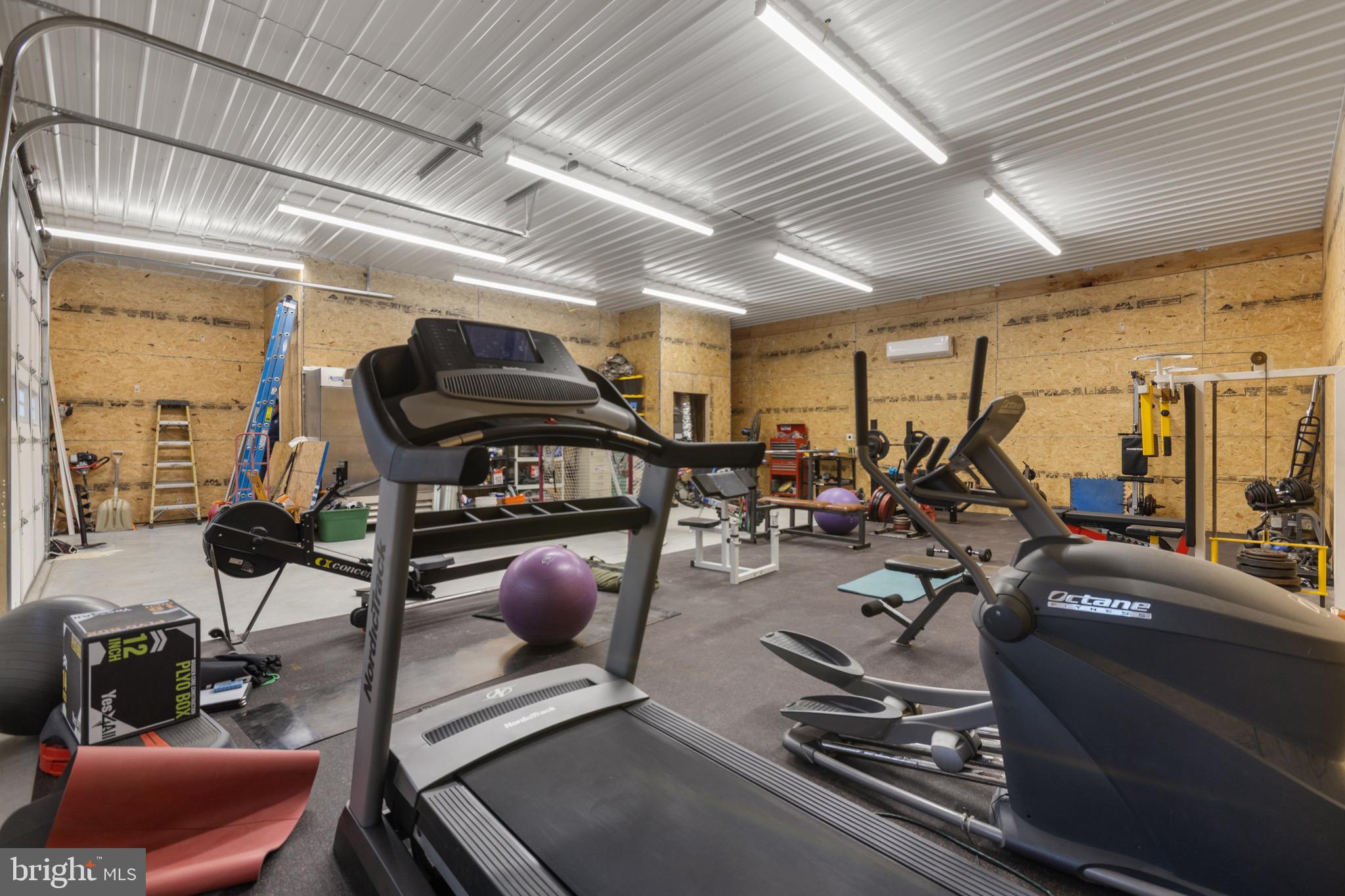 26179 Manor Way Georgetown, DE 19947 - Photo 44 of 87 a view of a room with gym equipment
