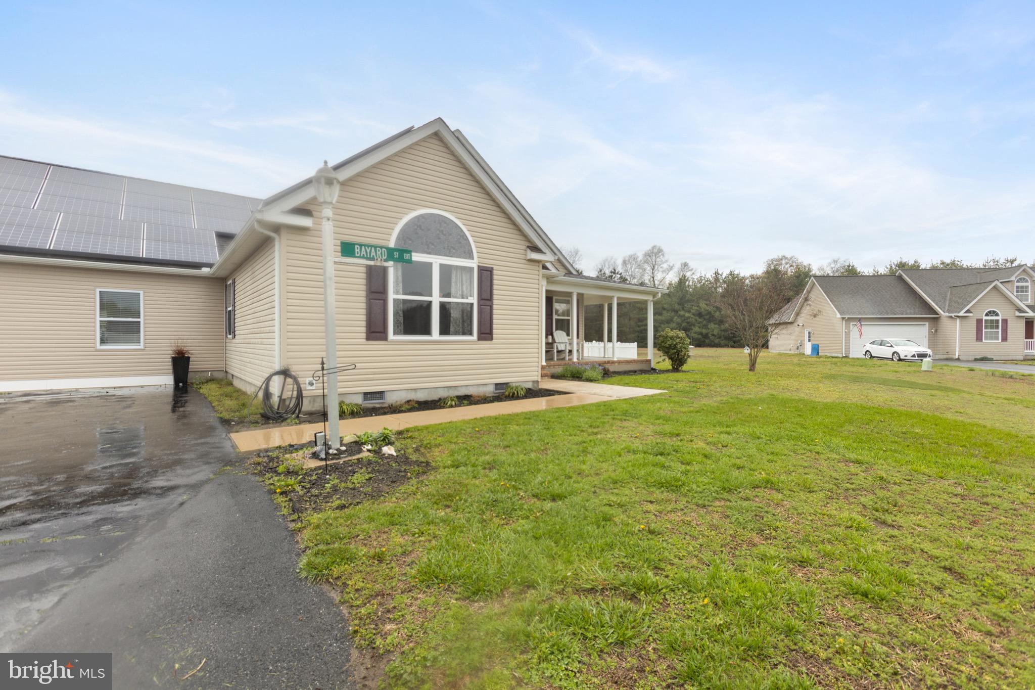 26179 Manor Way Georgetown, DE 19947 - Photo 48 of 87 a front view of a house with a yard