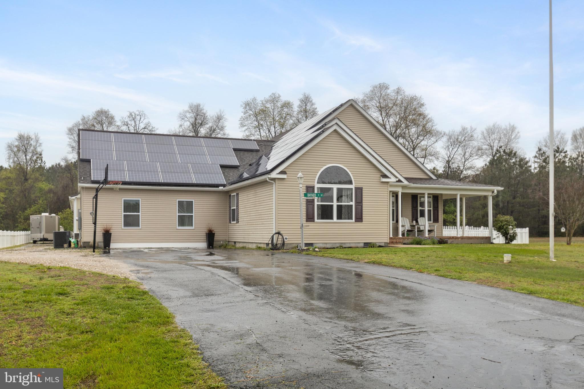 26179 Manor Way Georgetown, DE 19947 - Photo 49 of 87 a view of a white house with a big yard and large trees