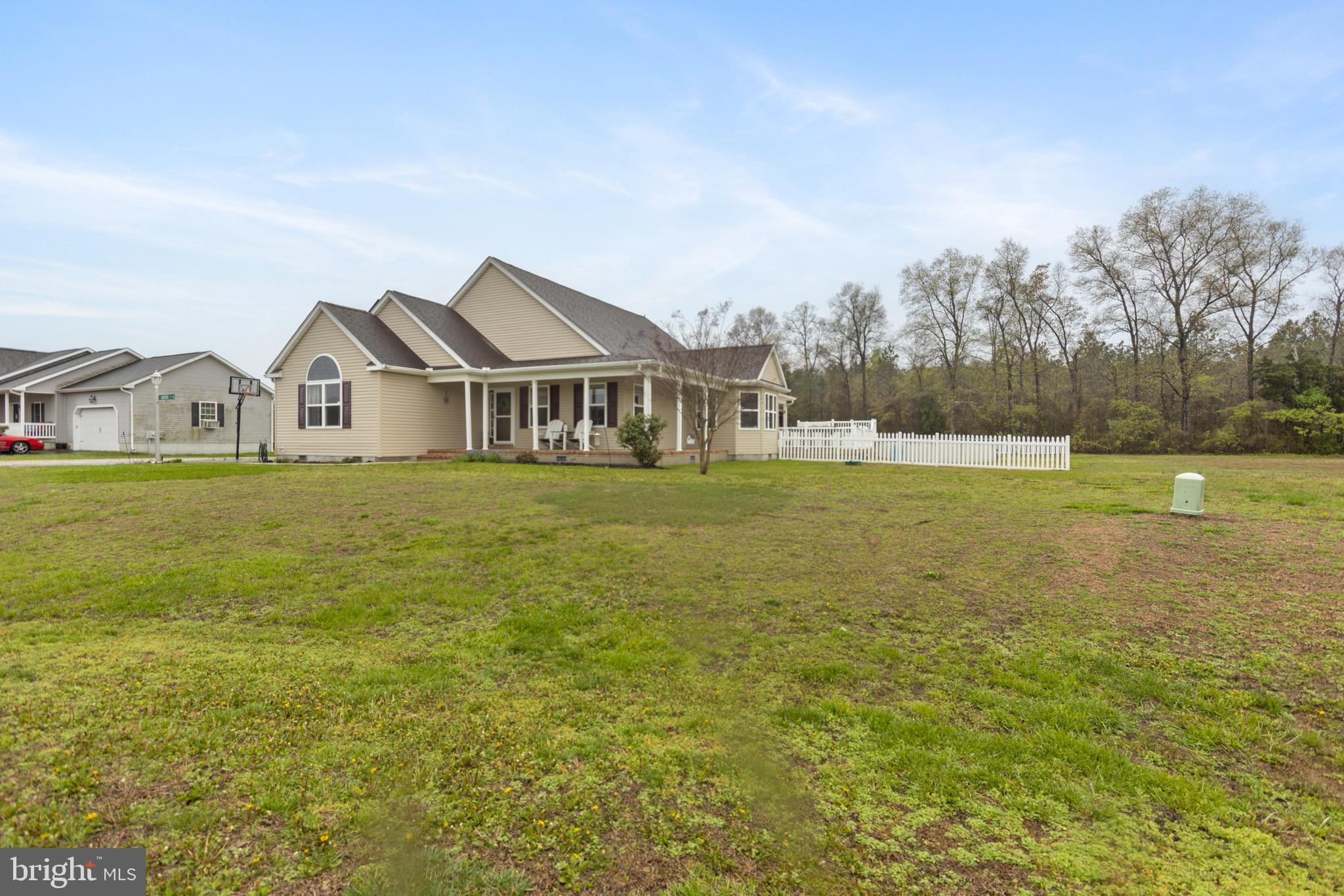 26179 Manor Way Georgetown, DE 19947 - Photo 53 of 87 a view of a house with a big yard and large trees