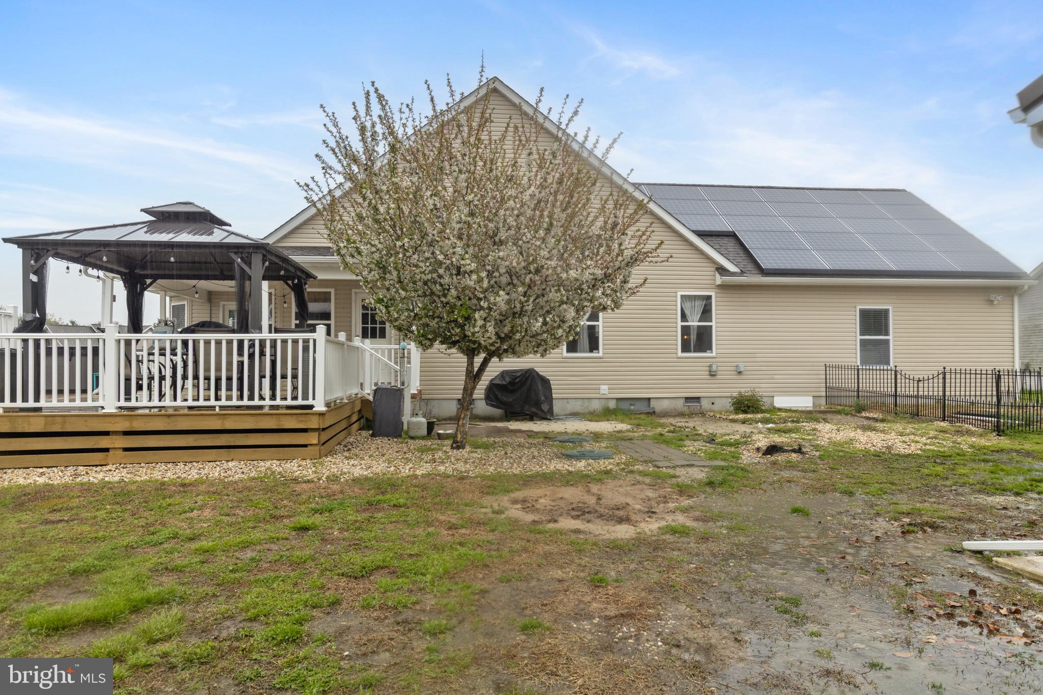 26179 Manor Way Georgetown, DE 19947 - Photo 59 of 87 a backyard of a house with table and chairs