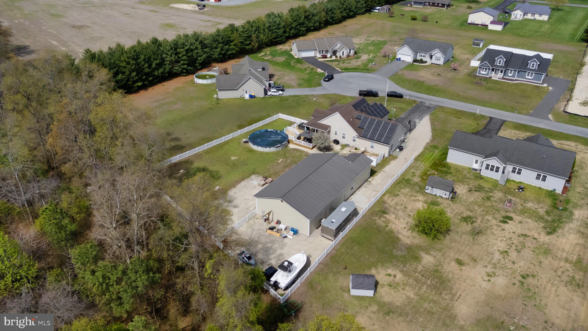 26179 Manor Way Georgetown, DE 19947 - Photo 7 of 87 an aerial view of a house with a yard