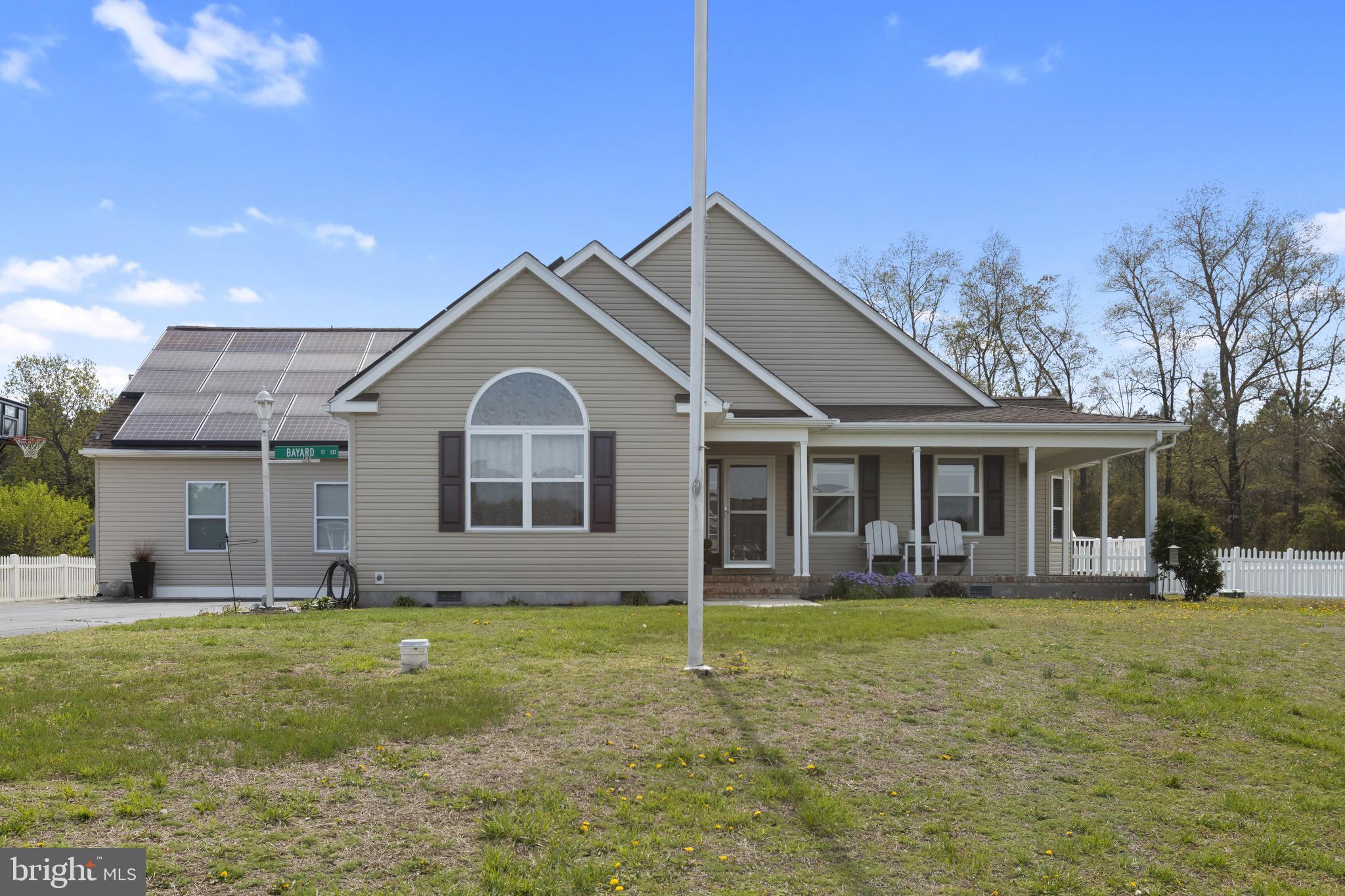 26179 Manor Way Georgetown, DE 19947 - Photo 72 of 87 a front view of a house with a yard