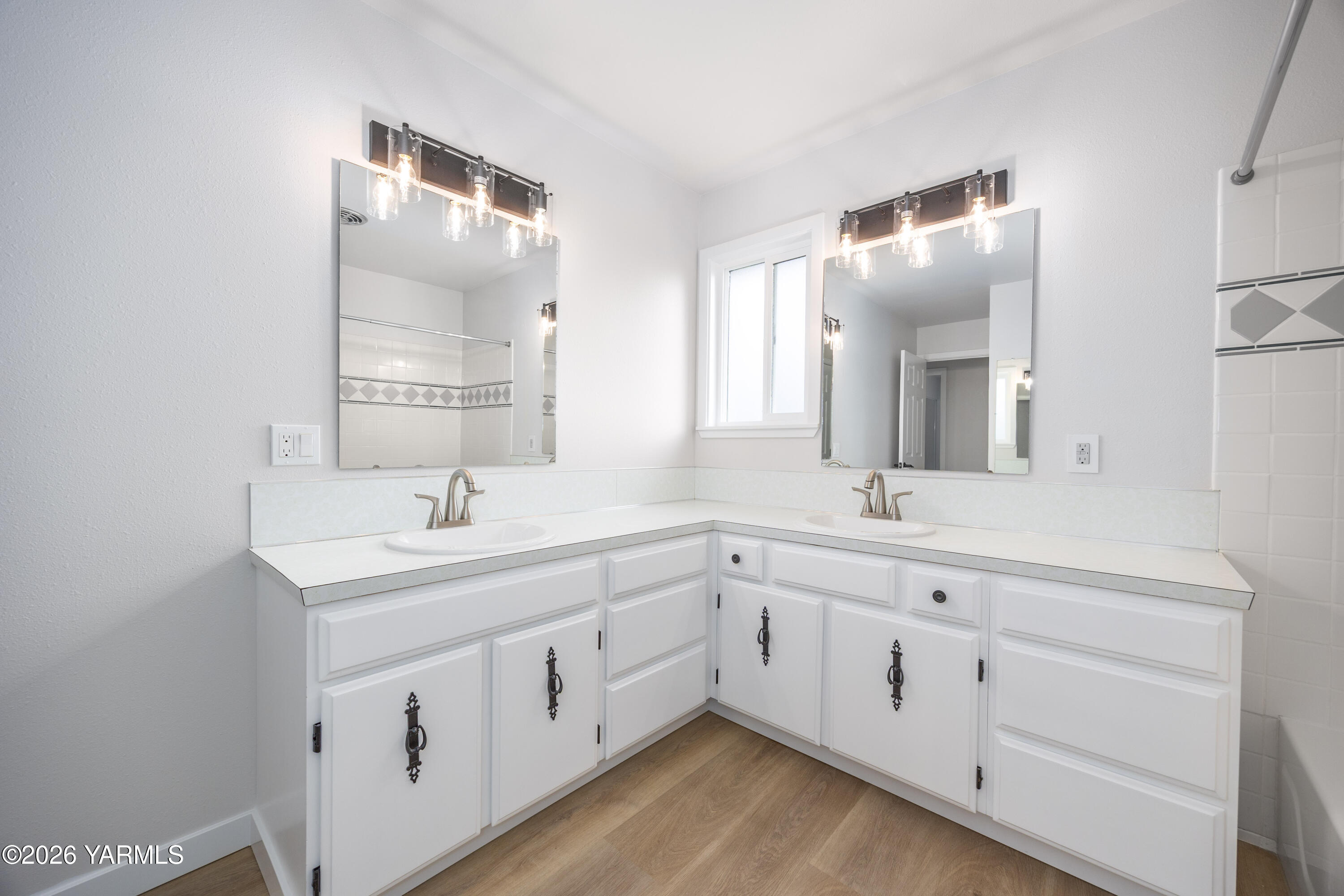 790 East Bonnieview Road Grandview, WA 98930 - Photo 15 of 49 a view with double vanity sink mirror and window