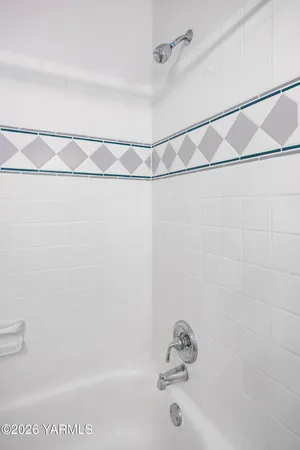 a bathroom with a shower and a bathtub