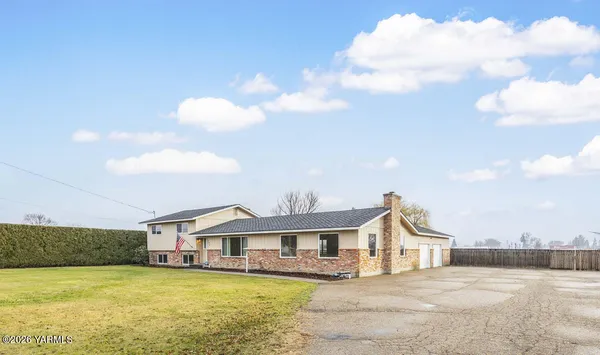 a view of a house with a swimming pool with a yard