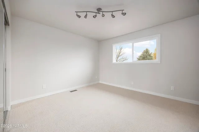 a view of a swimming pool with an outdoor space and seating area