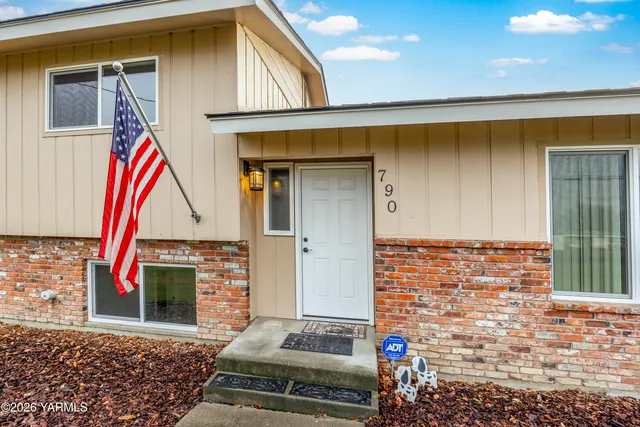 a swimming pool with outdoor seating