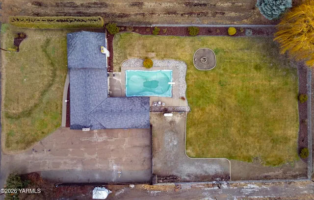 a view of a swimming pool with outdoor seating
