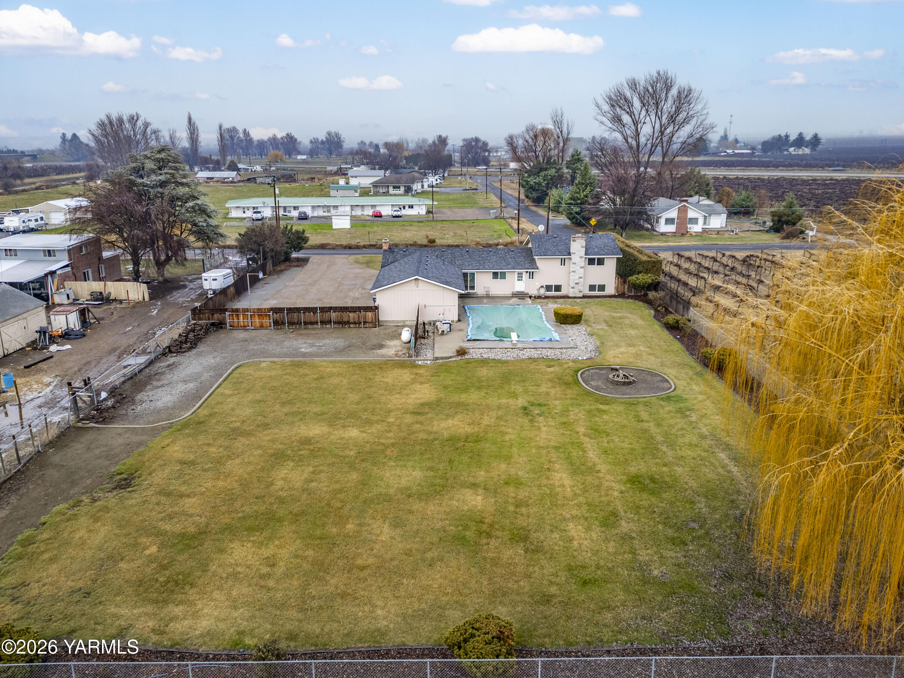 790 East Bonnieview Road Grandview, WA 98930 - Photo 48 of 49 a view of a swimming pool with outdoor seating and yard
