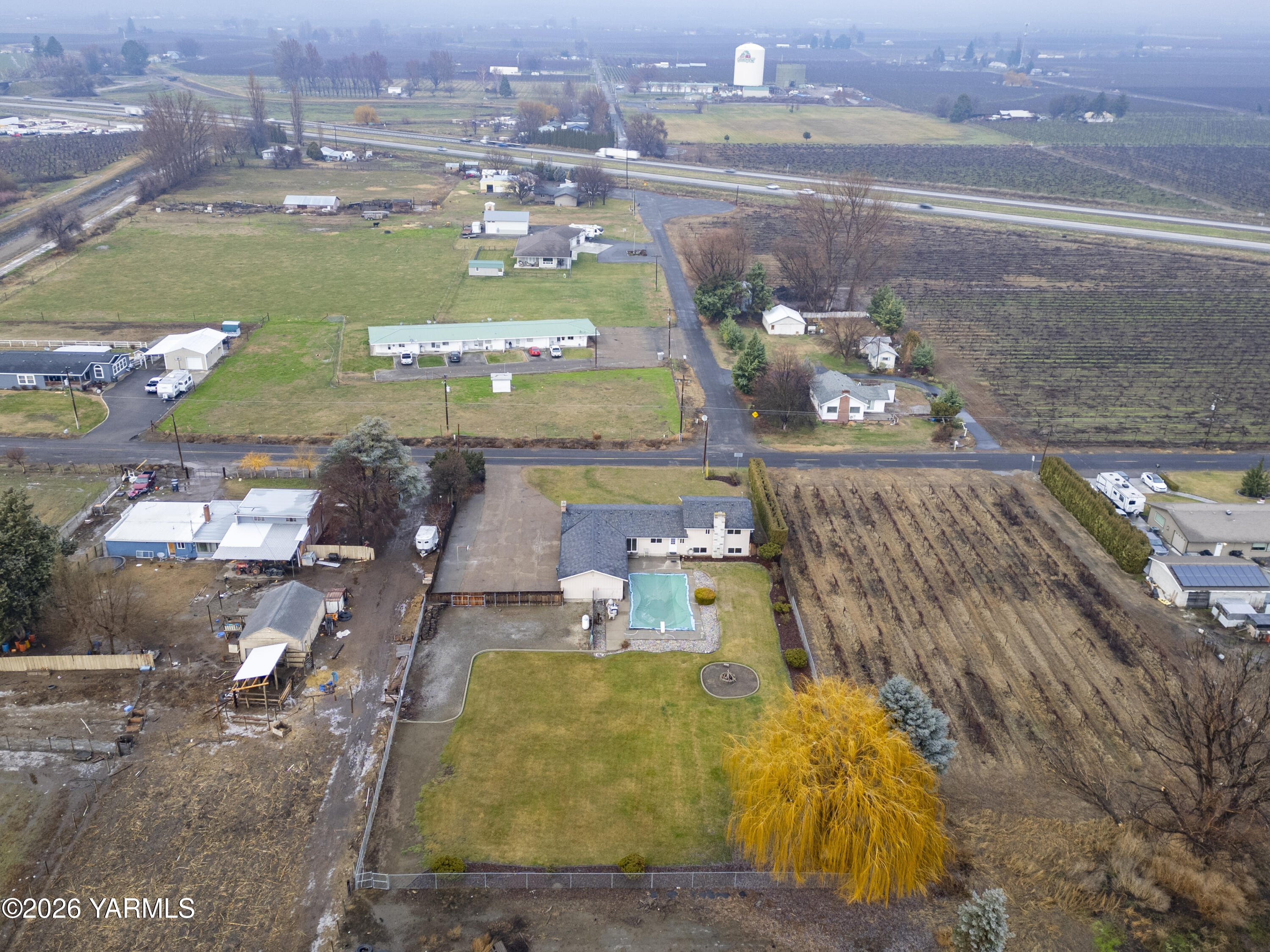 790 East Bonnieview Road Grandview, WA 98930 - Photo 49 of 49 a view of a swimming pool with a couple of cars parked in the yard