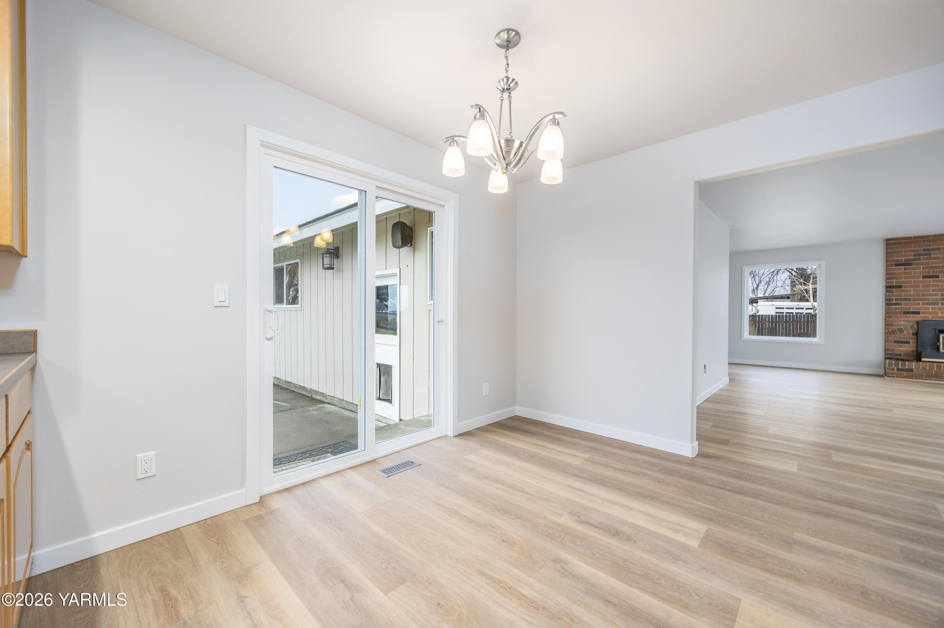 790 East Bonnieview Road Grandview, WA 98930 - Photo 9 of 49 wooden floor in an empty room with a window