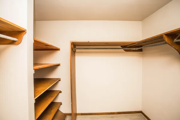 a bathroom with a white toilet and a shower