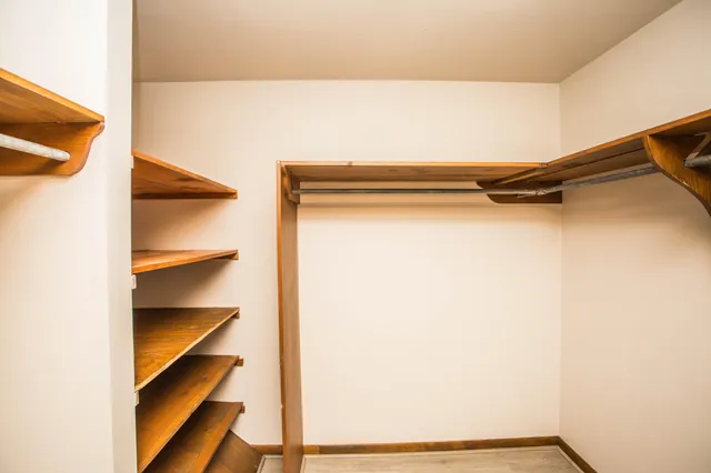 a bathroom with a white toilet and a shower