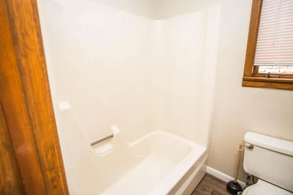 a view of room with window and ceiling fan