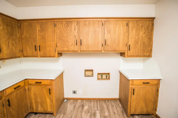 a view of wooden floor and windows in a room
